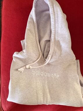 Adidas US XL light gray Heathered hoodie. I feel like it has a hint of pink.